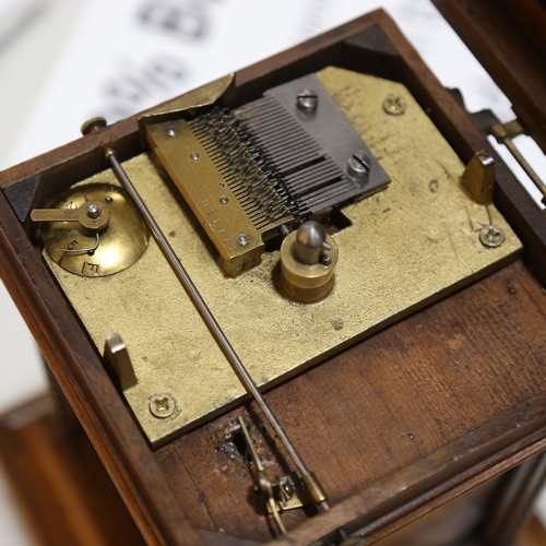 102 - A 19th century German walnut-cased symphonion table clock, carved and brass-mounted case, the top op... 