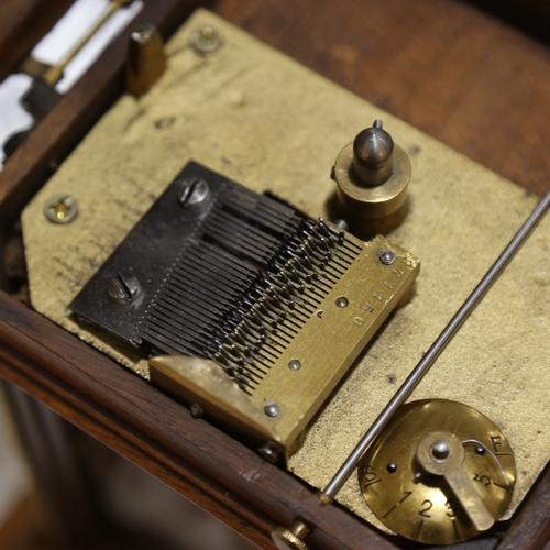 102 - A 19th century German walnut-cased symphonion table clock, carved and brass-mounted case, the top op... 