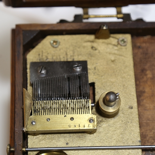 102 - A 19th century German walnut-cased symphonion table clock, carved and brass-mounted case, the top op... 