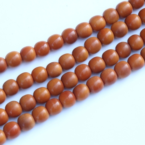 242 - A string of honey coloured natural horn beads, possibly rhino horn