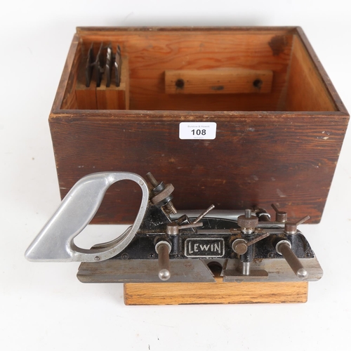 108 - An Antique Lewin carpenter's combination woodworking plane, in original fitted pine case with spare ... 