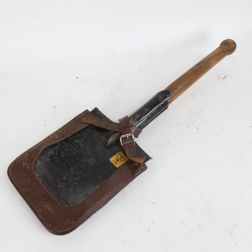 117 - A Second World War British army German-Pattern trench shovel, with original leather cover and broad ... 