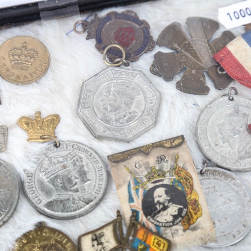 130 - A collection of medals and medallions, including Edward VII medal, Coronation medals etc