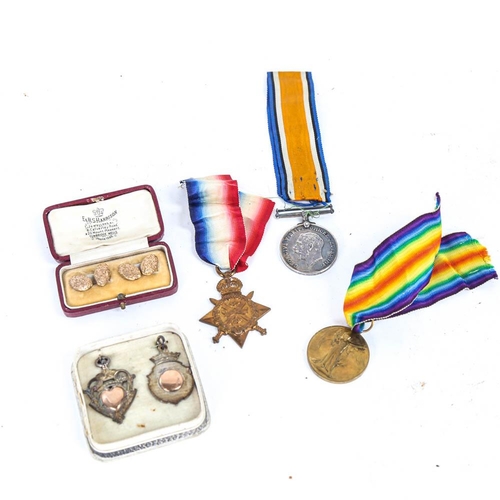 131 - A group of 3 First World War medals to 39005 Driver W E Kinge RHA, cufflinks and silver medals