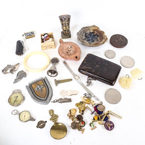 147 - A box of interesting items, including badges, bell, miniature shoe, Royal memorabilia, oil lamp etc