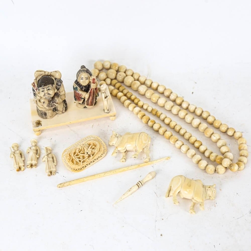 148 - Ivory balls and figures, brooch, composition netsukes etc