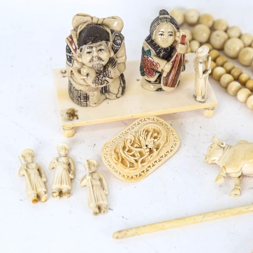 148 - Ivory balls and figures, brooch, composition netsukes etc