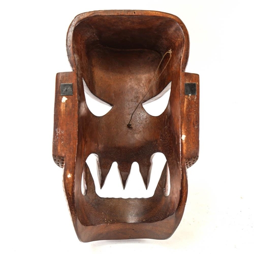 176 - A chip carved African mask, height 41cm