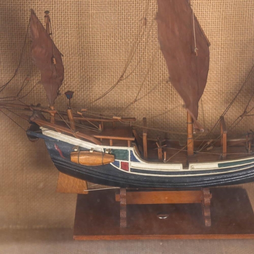 49 - A carved and painted model 3-masted ship, in glazed wall-mounted display case, height 35cm overall