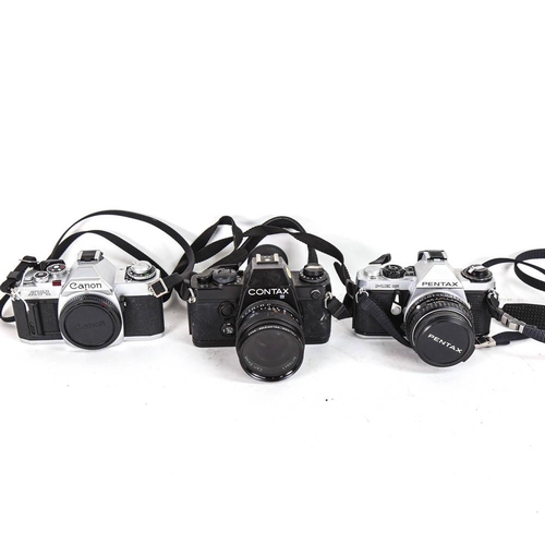 65 - 3 Vintage 35mm single lens reflex cameras, comprising Canon AV-1, Pentax ME Super and Contax 139 qua... 