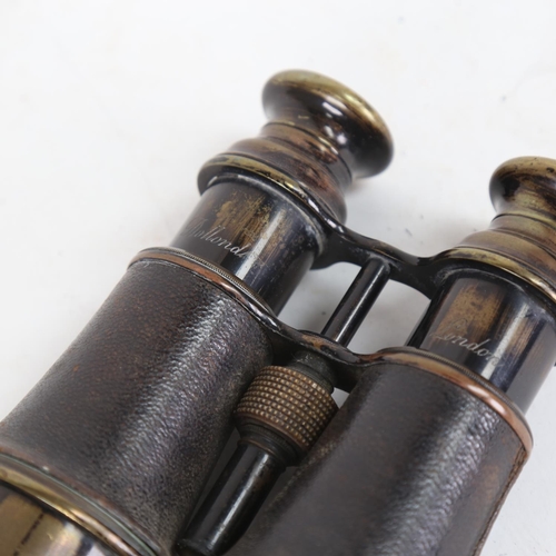 96 - A pair of brass and leather binoculars, marked Dollond of London