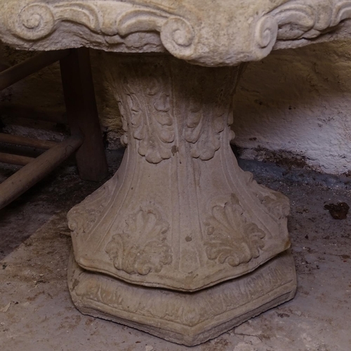 2402 - A concrete 2-section birdbath, on acanthus leaf pedestal, W50cm, H40cm