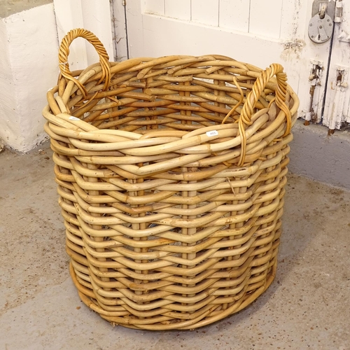 2409 - A large woven wicker 2-handled basket, W60cm, H55cm