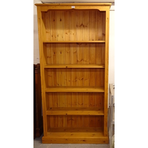 2414 - A modern polished pine open bookcase, with 4 fixed shelves, W91cm, H182cm, shelf depth 24cm