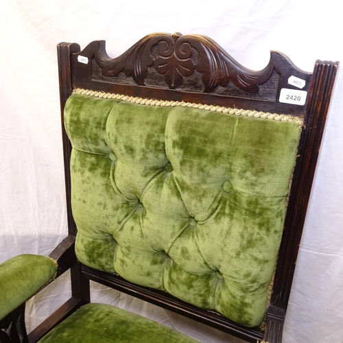 2420 - A Victorian carved framed and button-back upholstered open armchair