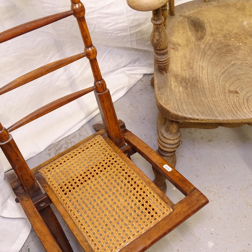 2437 - A Victorian elm-seated smoker's bow-arm chair, and an Antique folding chair