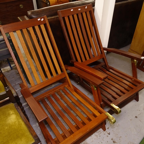 2447 - A pair of modern teak folding steamer chairs with cushions