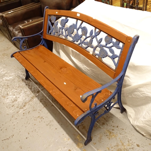 2458 - A blue painted wrought-iron garden bench, with panelled back, L127cm