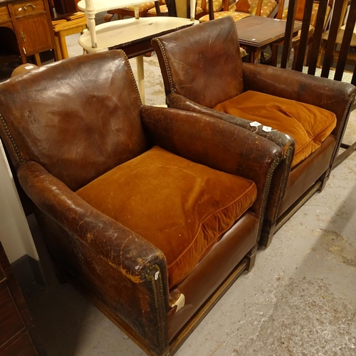 2464 - A pair of early 20th century studded leather-upholstered Club chairs, on stained wood stretchers