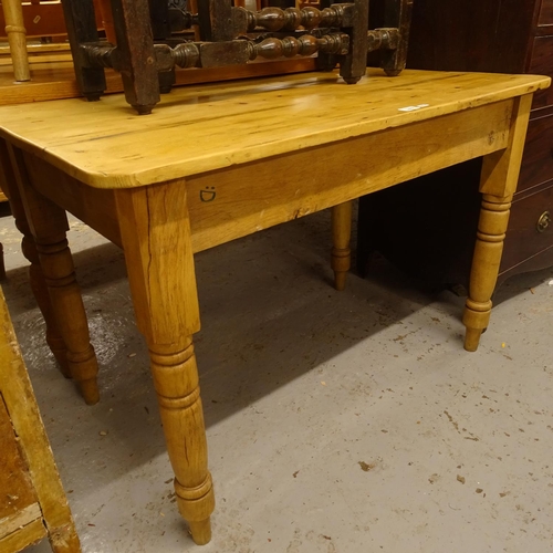 2467 - A rectangular pine kitchen table on turned legs, W108cm, H73cm, D65cm (drawer missing)