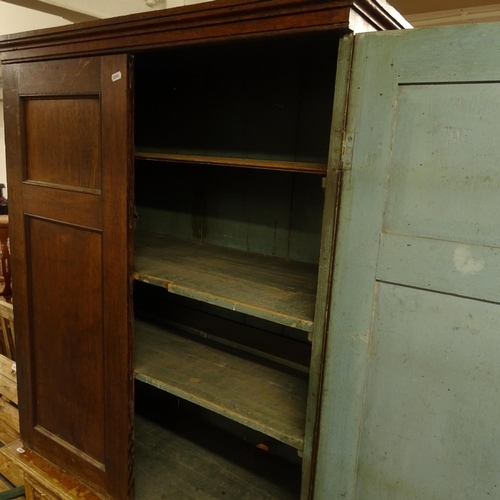 2470 - A Georgian oak cabinet, with 2 panelled doors opening to reveal a shelved painted interior, W85cm, H... 