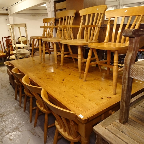 2474 - A large rectangular polished pine farmhouse table, with end frieze drawers, on turned baluster legs,... 