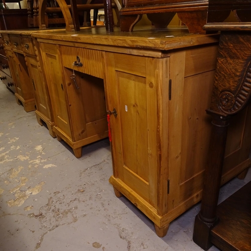 2485 - A rectangular pine writing desk, with green leather skiver, with fitted drawer and cupboards, W122cm... 