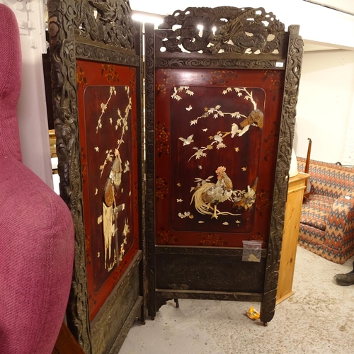 2497 - A Chinese carved and lacquered 2-fold screen, dragon carved pediments above mother-of-pearl and bone... 