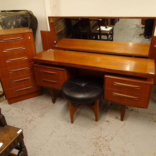 2510 - A mid-century G Plan teak bedroom suite, comprising a 6-drawer chest, a kneehole dressing table and ... 