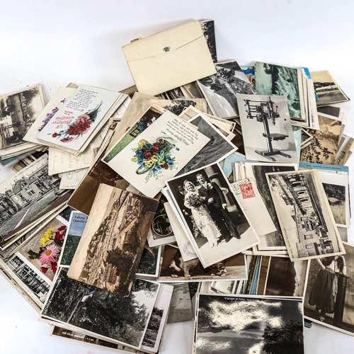 192 - A box of loose postcards