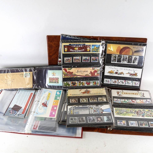 211 - 4 albums of British First Day Covers and Mint stamps