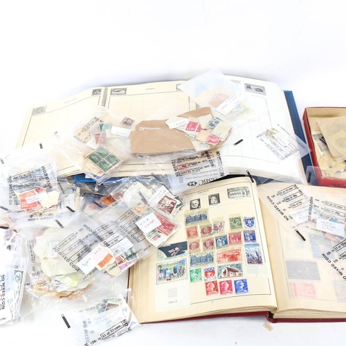 215 - 2 postage stamp albums and a collection of stamps, including French, British and African