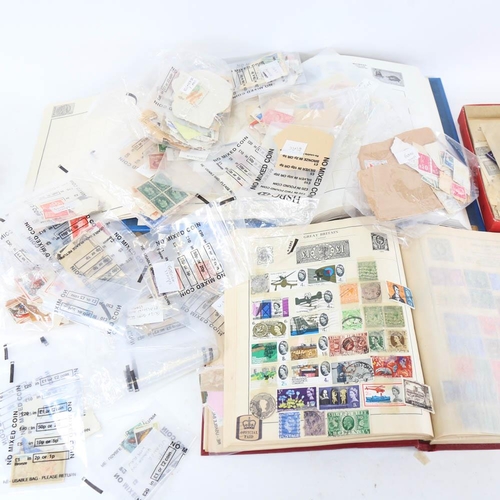 215 - 2 postage stamp albums and a collection of stamps, including French, British and African