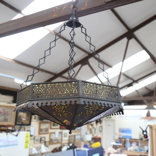 476 - An octagonal pierced metal hanging light fitting, with amber glass inserts, 53cm across