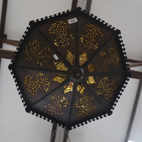 476 - An octagonal pierced metal hanging light fitting, with amber glass inserts, 53cm across