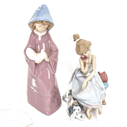 497 - Lladro porcelain figure of a girl on the telephone, height 20cm, and NAO figure, girl with a dove (2... 