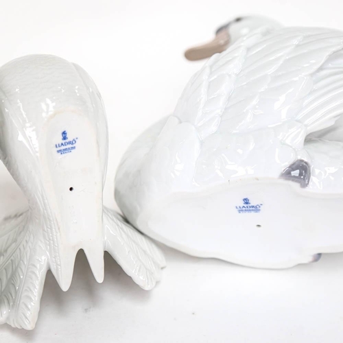 501 - Lladro porcelain swan, height 18cm, and a pair of Lladro doves