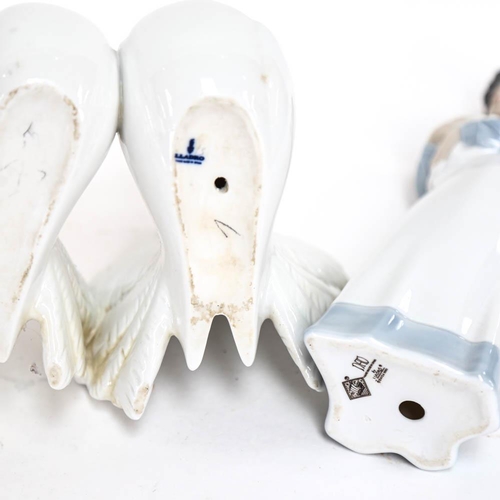 504 - Lladro porcelain doves, and a NAO girl with puppy, 23cm