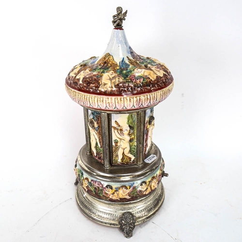 536 - Italian porcelain musical cigarette dispenser, with Swiss movement, height 32cm