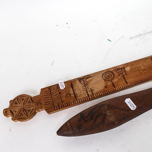 540 - An Aboriginal club, 59cm, and a Scandinavian carving