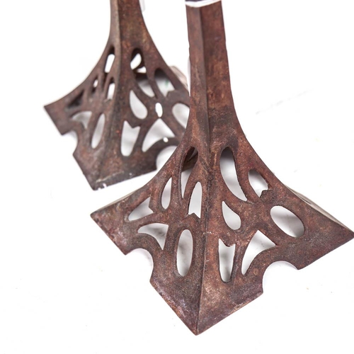 551 - A large pair of Arts and Crafts style wrought-iron candlesticks, height 50cm