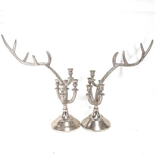 552 - A pair of plated antler design candelabra, height 63cm