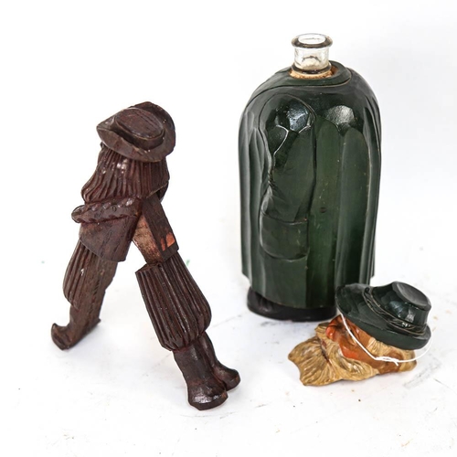 555 - A 19th century Black Forest carved wood figural nutcracker, length 21cm, and a carved and painted wo... 