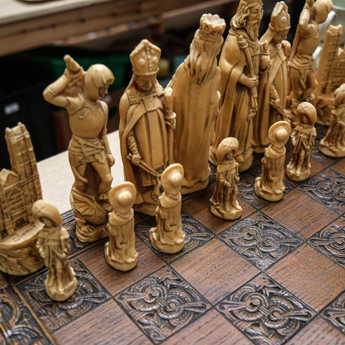 557 - A set of composition chessmen with board, King height 20cm