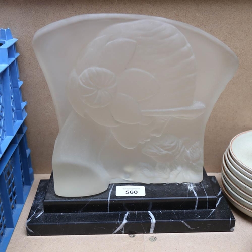 560 - A moulded glass sculpture of a lady smelling a rose, on marble plinth, height 25cm