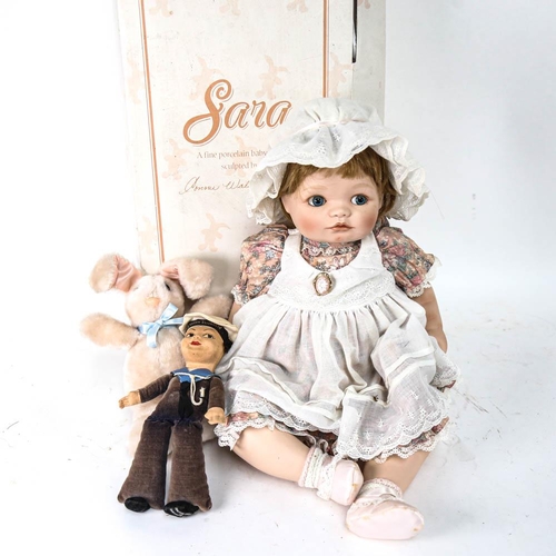 569 - Vintage Nora Wellings sailor doll, and a boxed porcelain-headed doll, and a soft toy rabbit