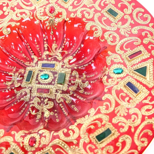 587 - Middle Eastern red glass dish, with jewelled and gilded decoration, 41cm