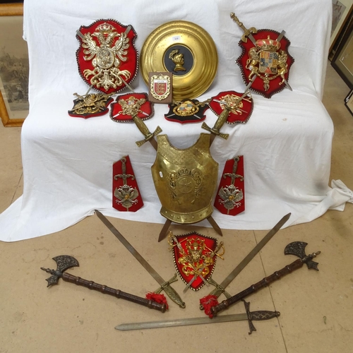 630 - Various decorative mounted coats of arms, reproduction swords and axes, wall plaque etc