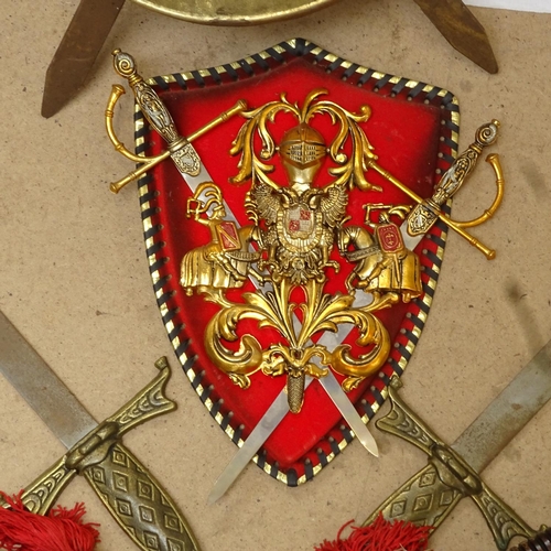 630 - Various decorative mounted coats of arms, reproduction swords and axes, wall plaque etc