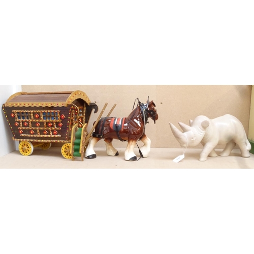 636 - A Dray horse with caravan, and a carved soapstone rhino, length 40cm